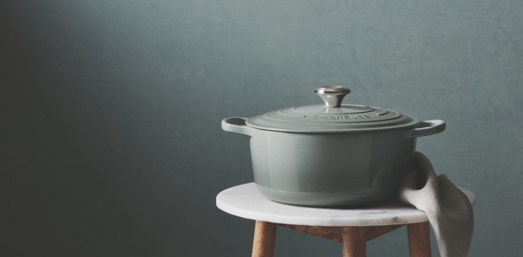 Le Creuset Sea Salt Casserole sitting on a stool